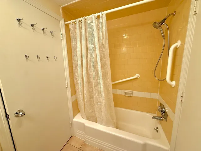 a bathroom with a shower and a tub