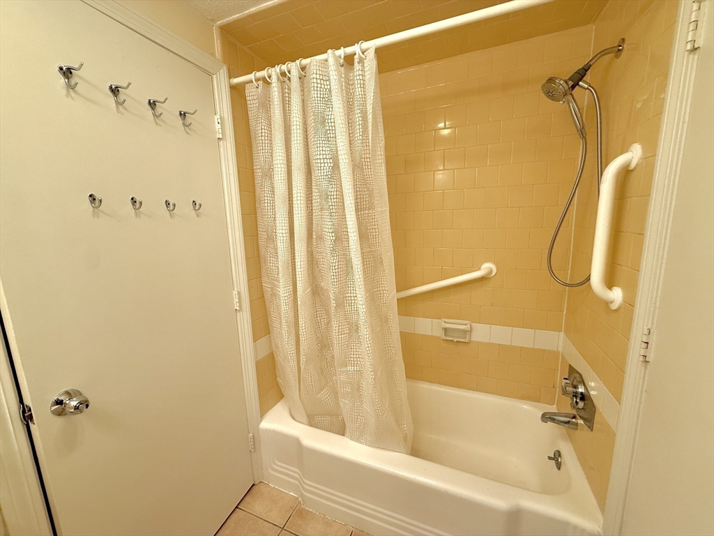 276 Main Street, Unit 3C Acton, MA 01720 - Photo 10 of 12 a bathroom with a shower and a tub