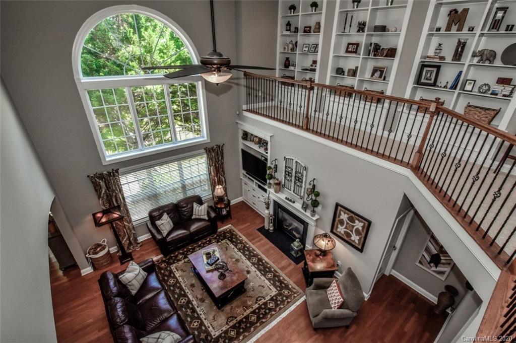 8723 Savannah Road Harrisburg, NC 28075 - Photo 28 of 44 a living room with furniture and a window