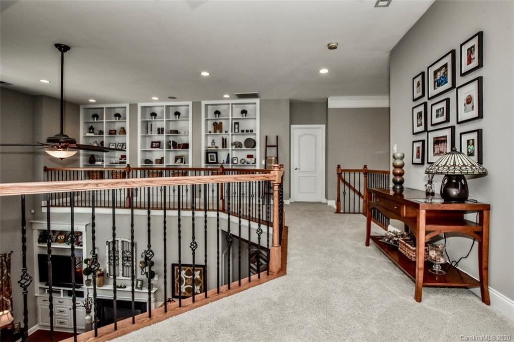 8723 Savannah Road Harrisburg, NC 28075 - Photo 30 of 44 a reading room with furniture and book shelf