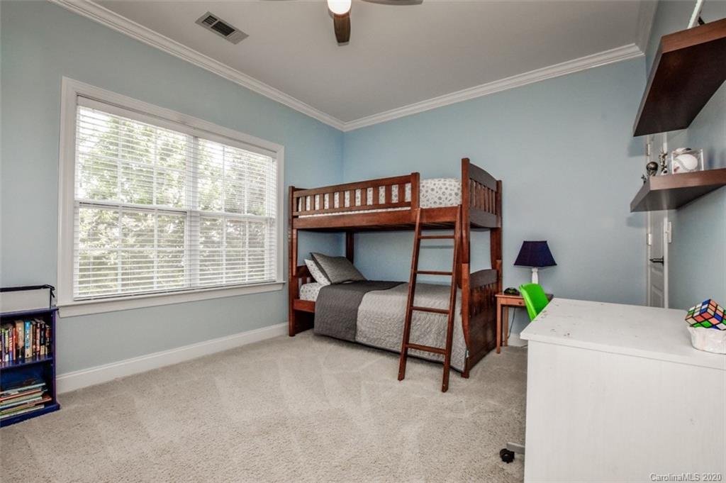 8723 Savannah Road Harrisburg, NC 28075 - Photo 34 of 44 a bedroom with furniture and a window