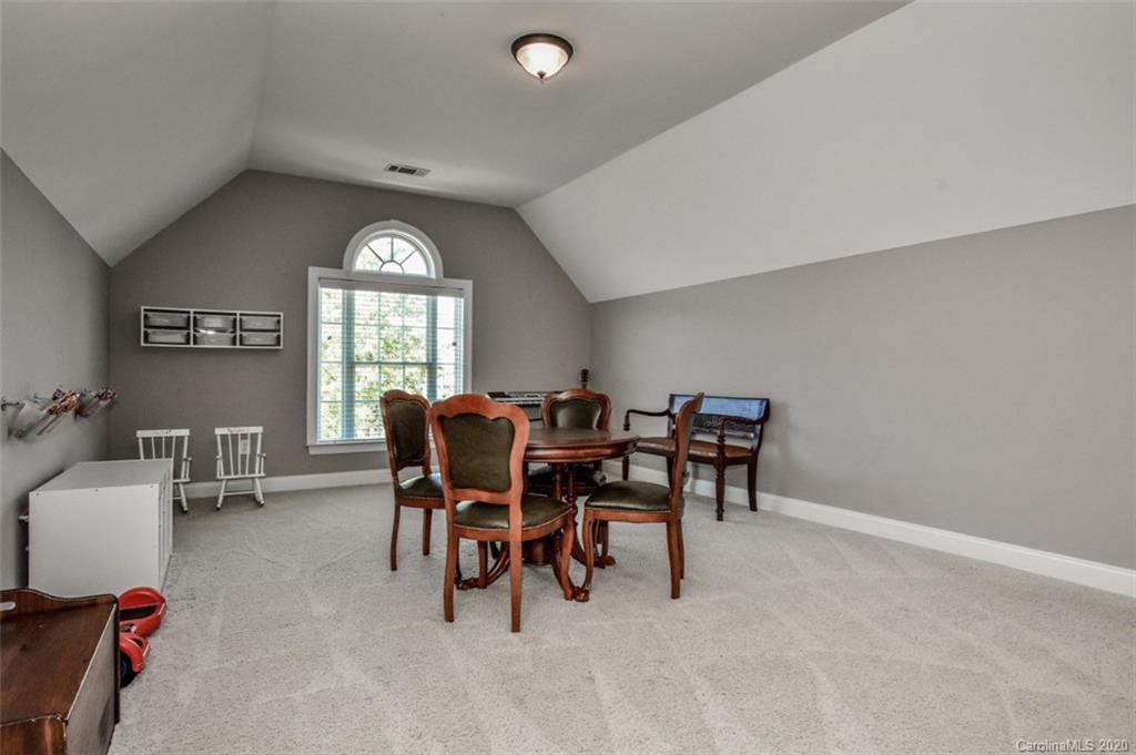 8723 Savannah Road Harrisburg, NC 28075 - Photo 39 of 44 a view of a dining room with furniture and a window