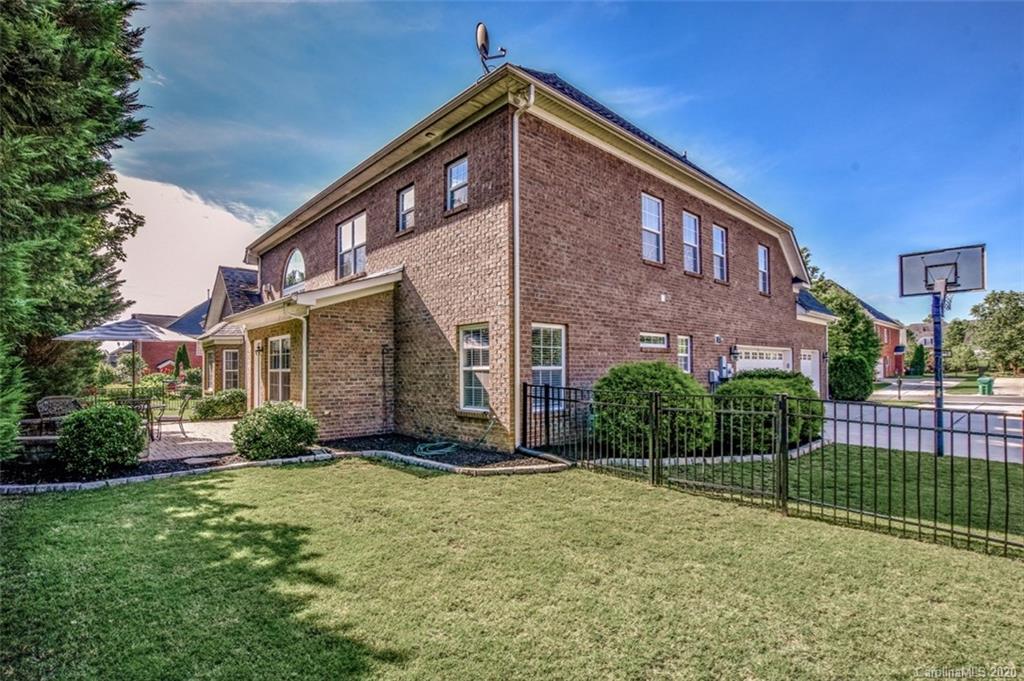8723 Savannah Road Harrisburg, NC 28075 - Photo 40 of 44 a front view of a house with a yard