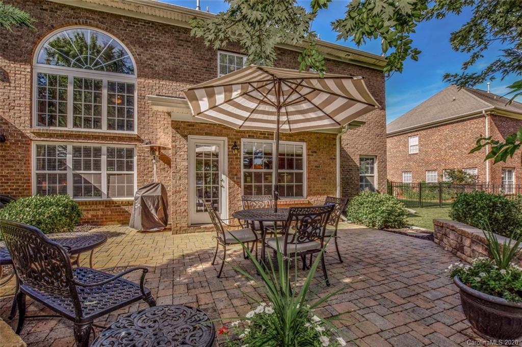 8723 Savannah Road Harrisburg, NC 28075 - Photo 43 of 44 a view of a house with backyard and sitting area