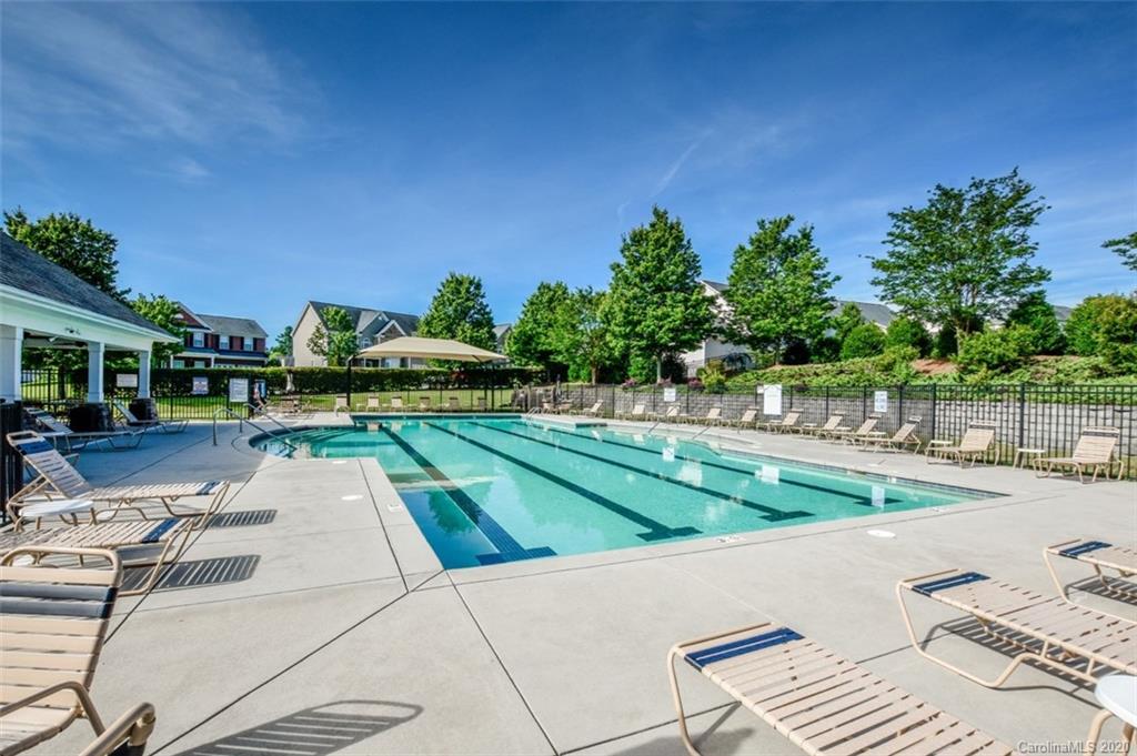 8723 Savannah Road Harrisburg, NC 28075 - Photo 44 of 44 a view of backyard with swimming pool and outdoor seating