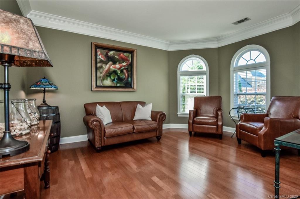 8723 Savannah Road Harrisburg, NC 28075 - Photo 6 of 44 a living room with furniture and a large window