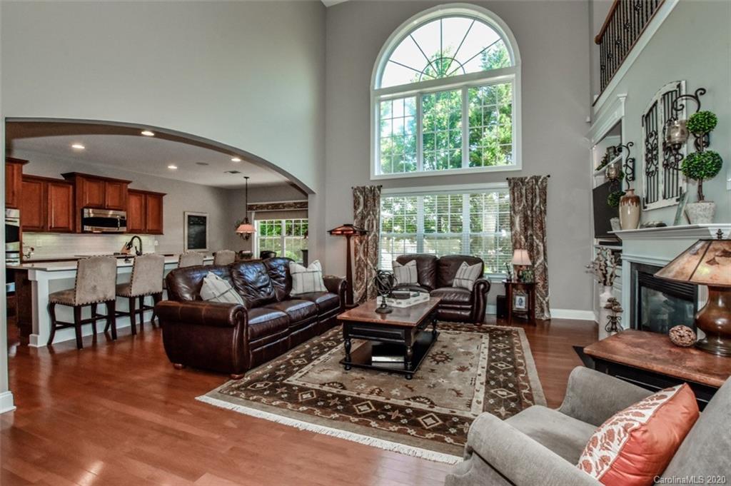 8723 Savannah Road Harrisburg, NC 28075 - Photo 8 of 44 a living room with furniture and a large window