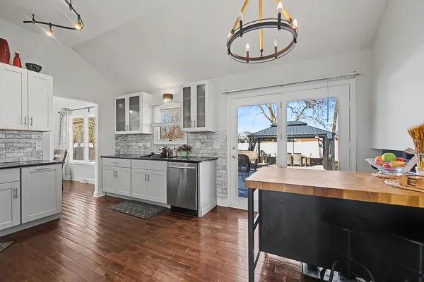a kitchen with a sink cabinets and window