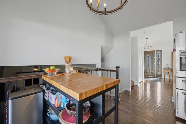 a view of a kitchen with a table and chairs