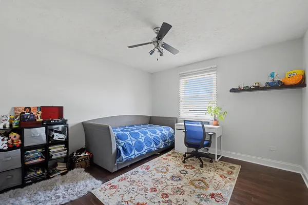 a bedroom with bed and a window