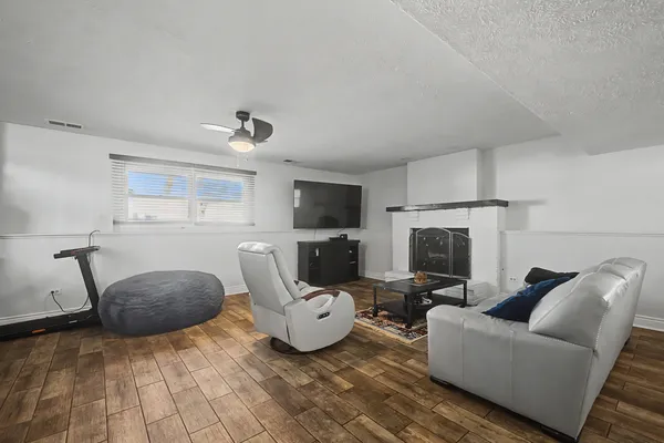 a living room with furniture and a fireplace