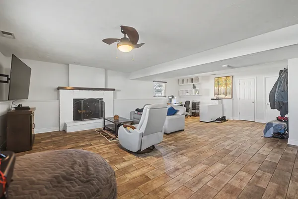a living room with furniture and a fireplace