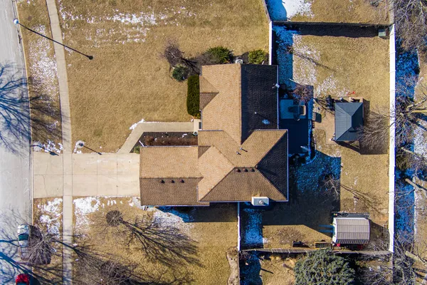 an aerial view of residential houses with outdoor space