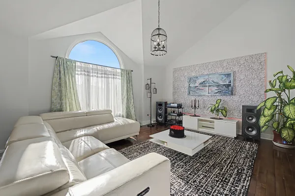 a bedroom with furniture and a window