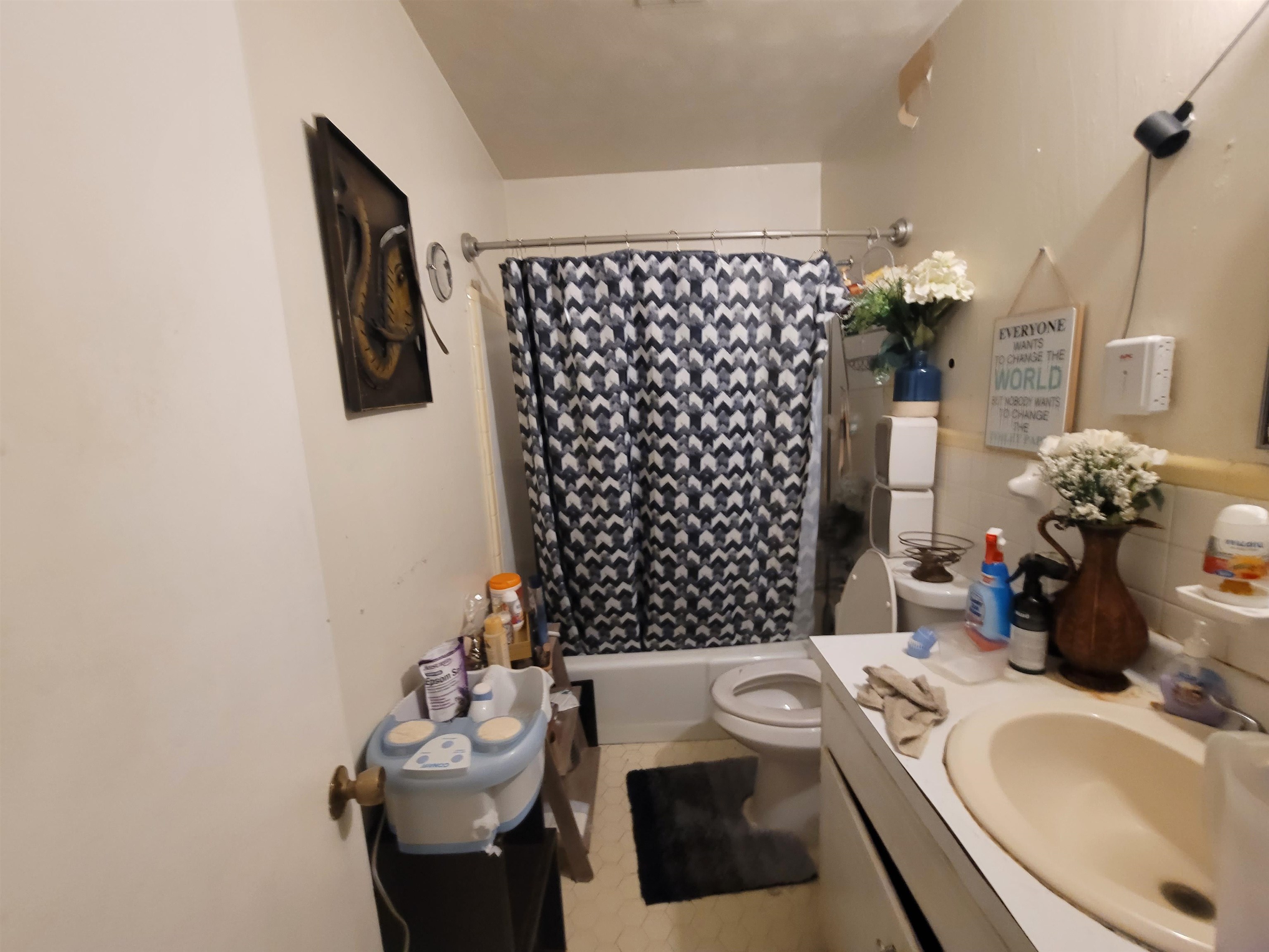 Bathroom with vanity and shower / bath combination with curtain