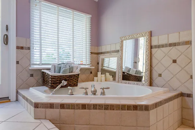 a dining room with a large window and couch