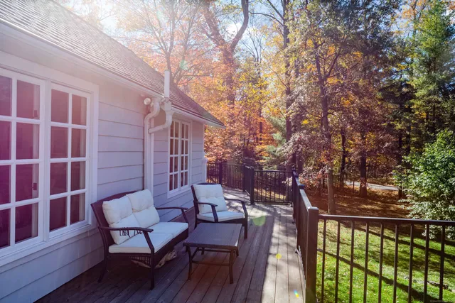 a view of a chairs and table in the balcony
