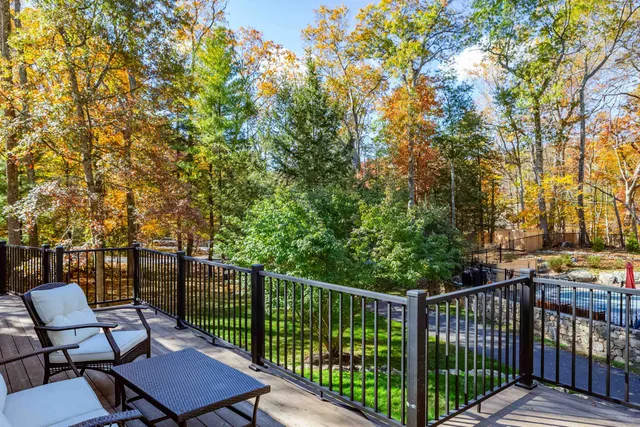 a view of a chairs and table in the roof deck