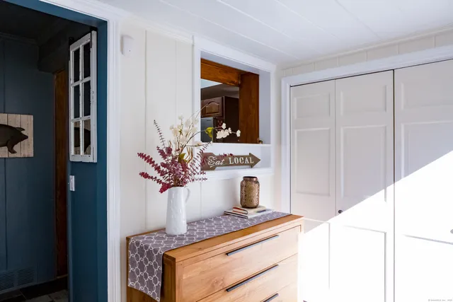 a living room with furniture and potted plant