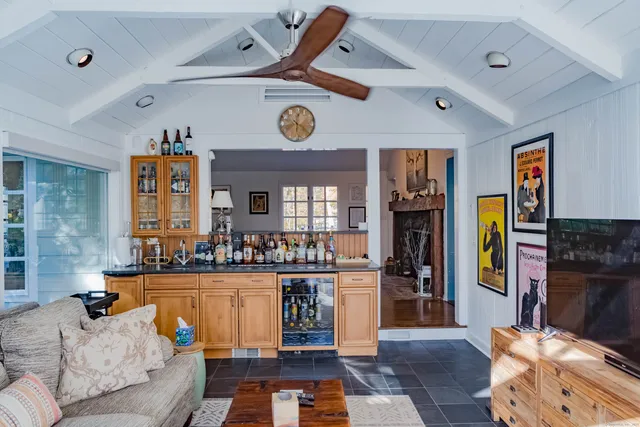 a living room with fireplace furniture and a window