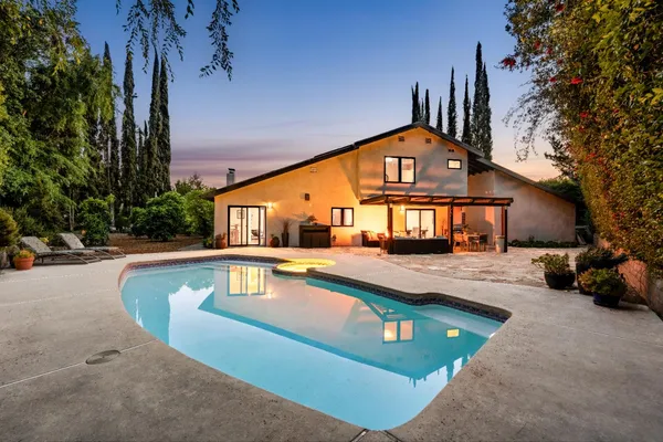 a view of a house with a swimming pool