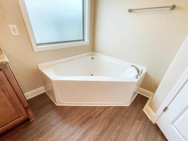 a view of a bathtub in a bathroom