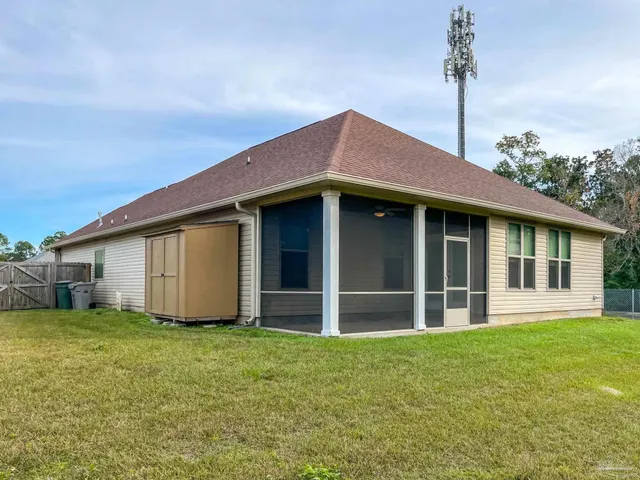 a view of a house with a yard