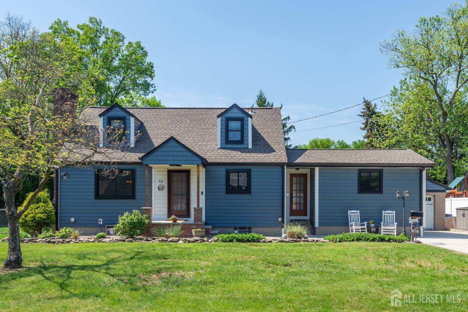 33 Orchard Road Middlesex, NJ 08846 - Photo 1 of 14 front view of a house with a yard