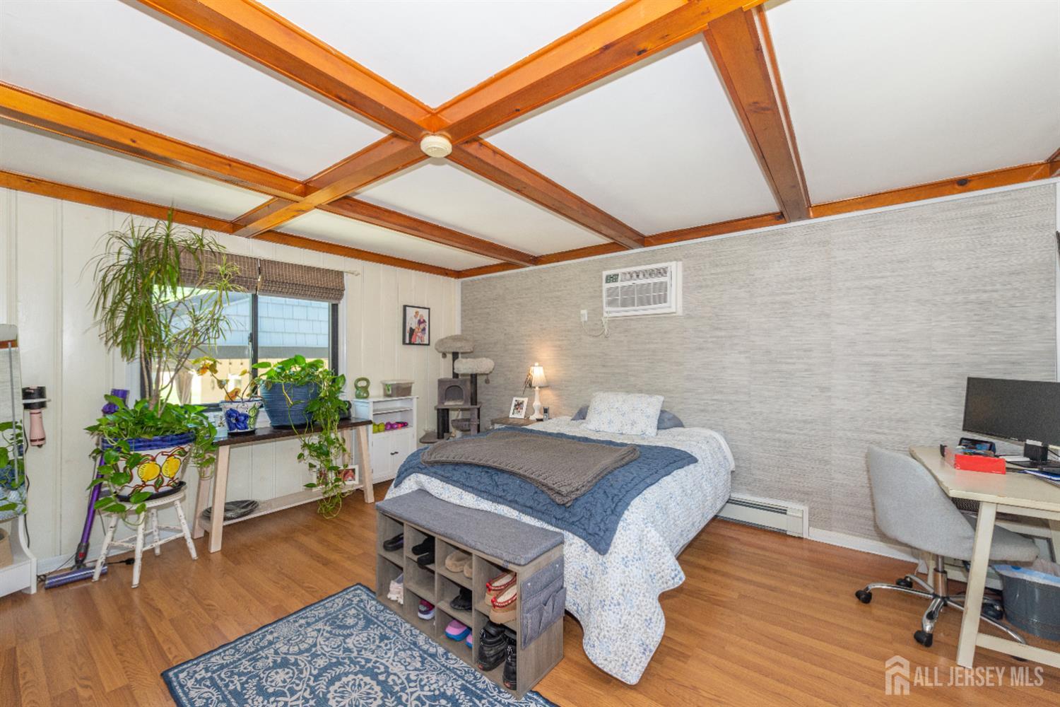 33 Orchard Road Middlesex, NJ 08846 - Photo 13 of 14 a bed room with a bed and a chair