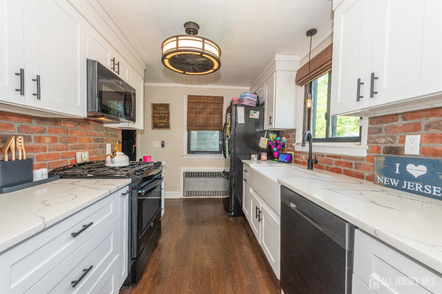 33 Orchard Road Middlesex, NJ 08846 - Photo 3 of 14 a kitchen with stainless steel appliances granite countertop a stove and a sink