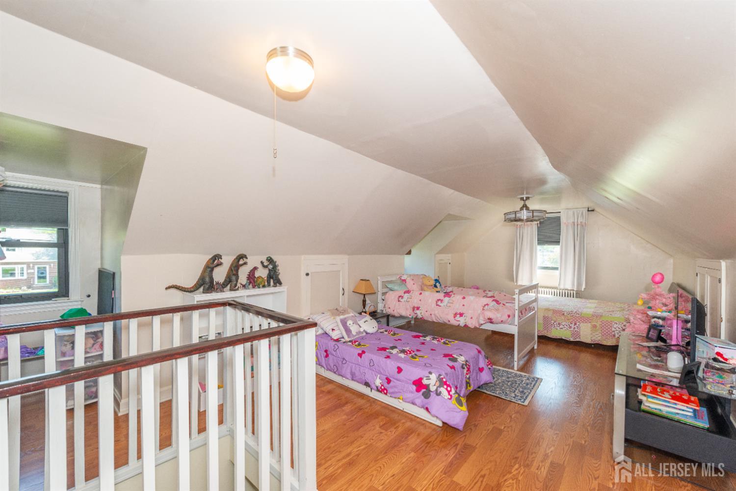 33 Orchard Road Middlesex, NJ 08846 - Photo 10 of 14 a bedroom with furniture and a baby crib