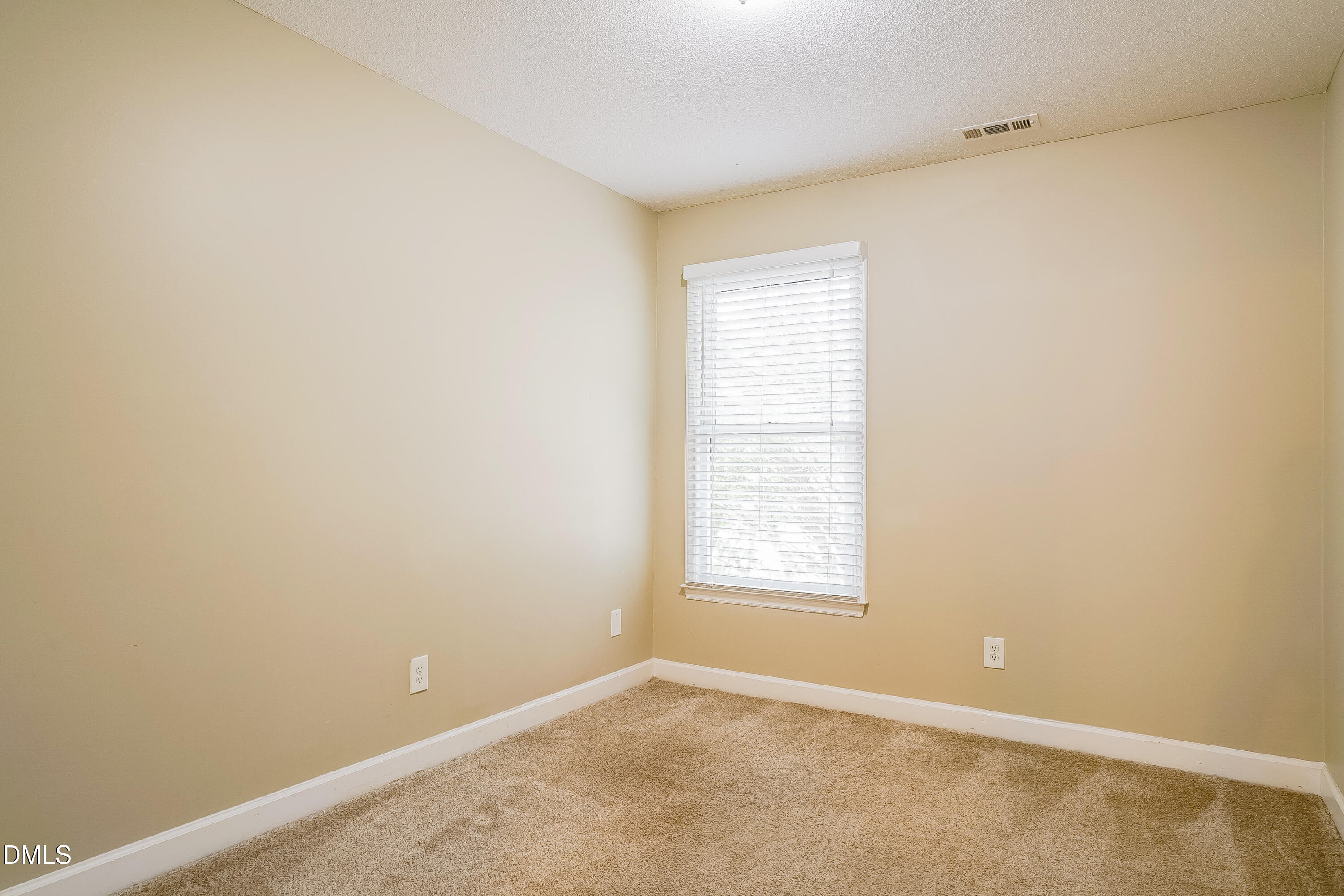 3636 Meadow Creek Lane Raleigh, NC 27616 - Photo 12 of 17 an empty room with windows