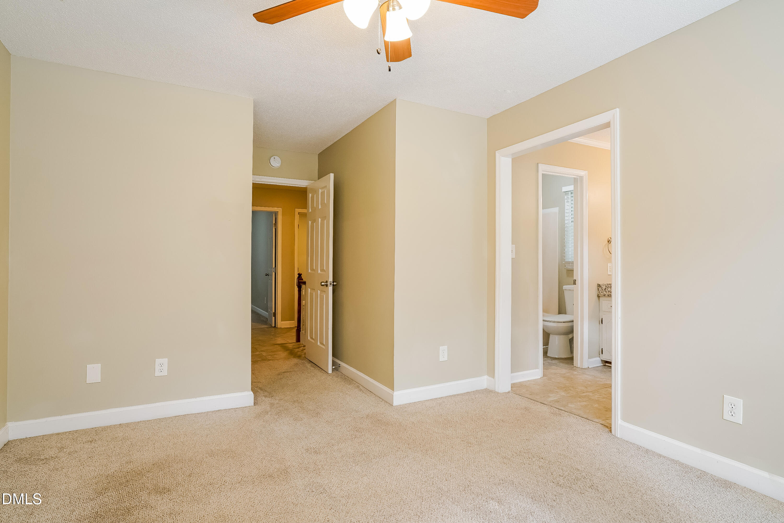 3636 Meadow Creek Lane Raleigh, NC 27616 - Photo 9 of 17 a view of a hallway with a chandelier fan