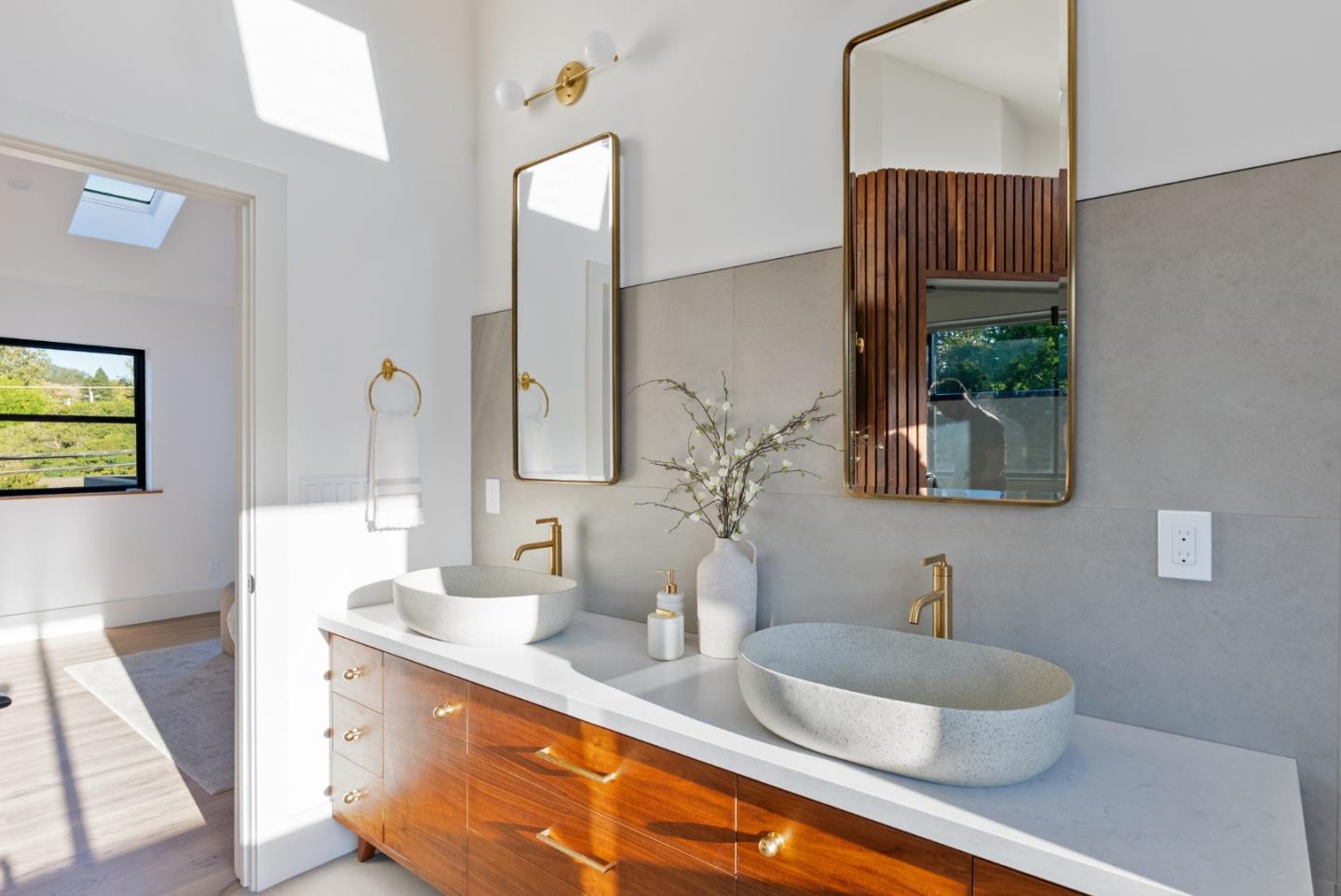 3240 North Main Street Soquel, CA 95073 - Photo 21 of 52 a bathroom with a double vanity sink and a mirror