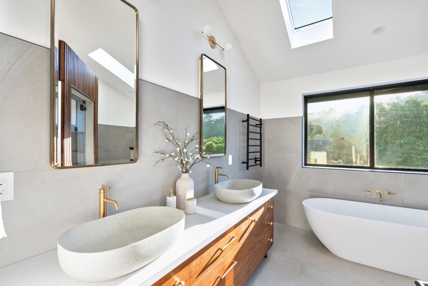 3240 North Main Street Soquel, CA 95073 - Photo 22 of 52 a bathroom with a granite countertop tub a double vanity sink and mirror