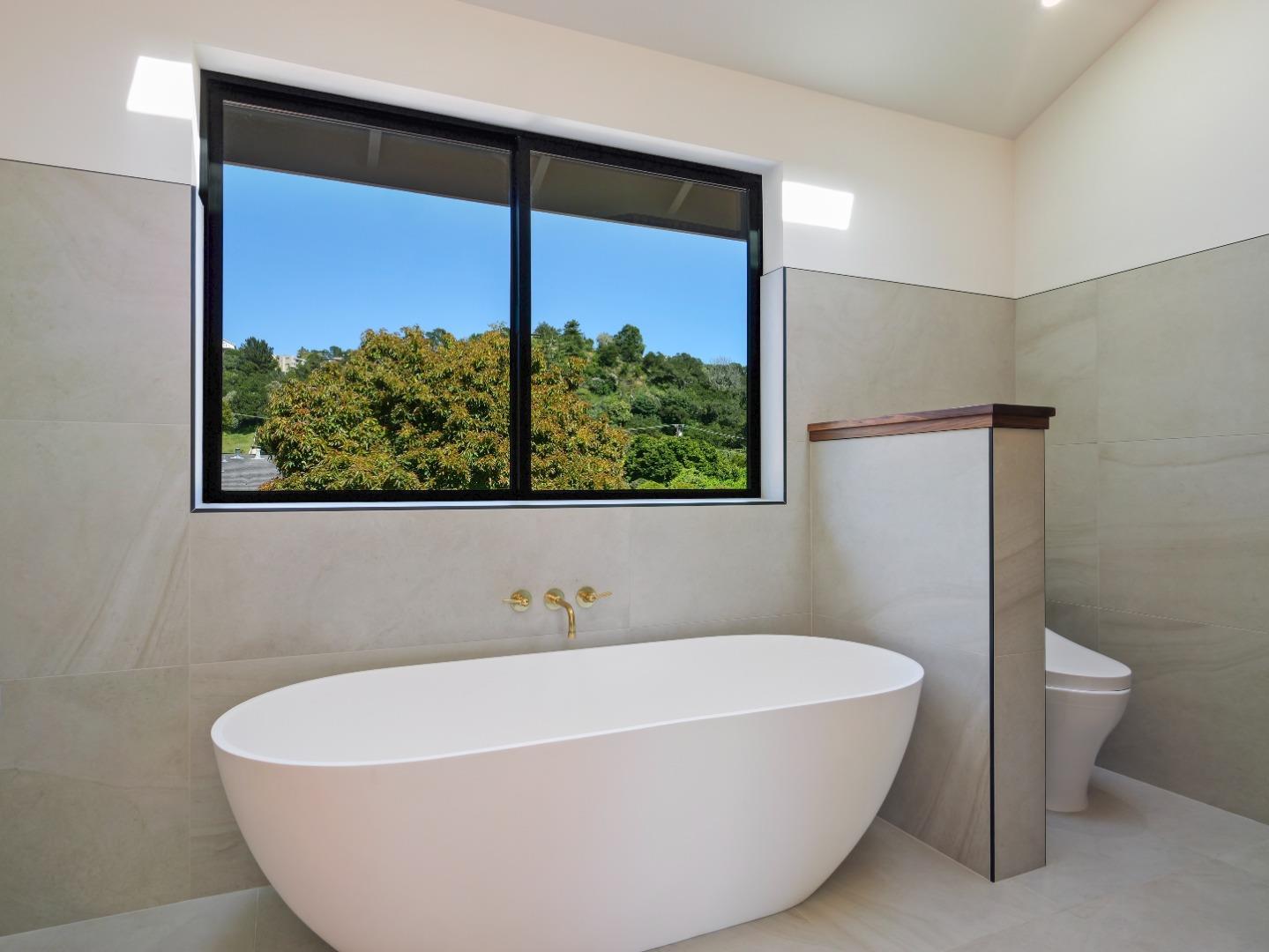 3240 North Main Street Soquel, CA 95073 - Photo 26 of 52 a white bath tub sitting in a bathroom