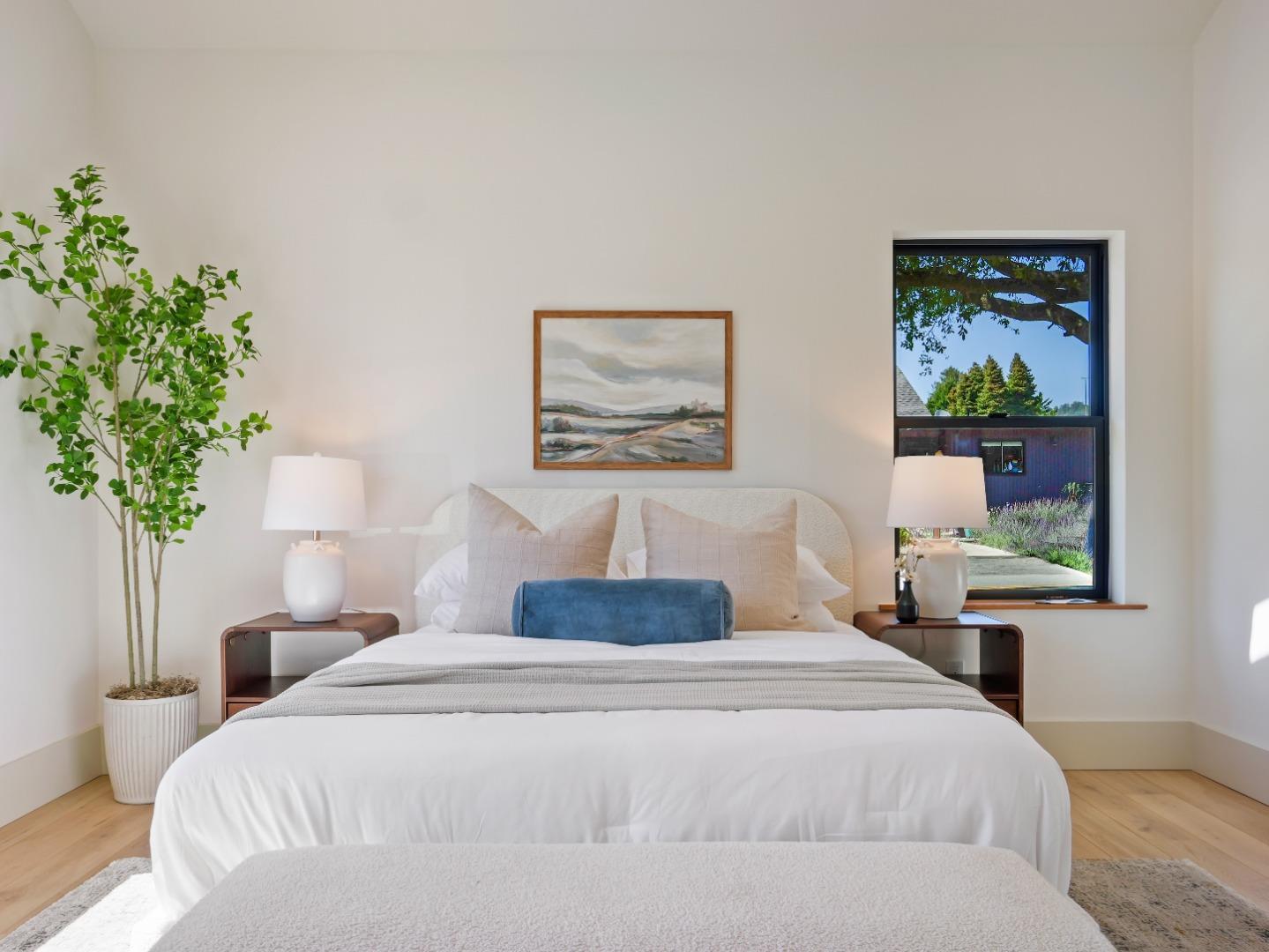 3240 North Main Street Soquel, CA 95073 - Photo 29 of 52 a bedroom with a large bed and a plant