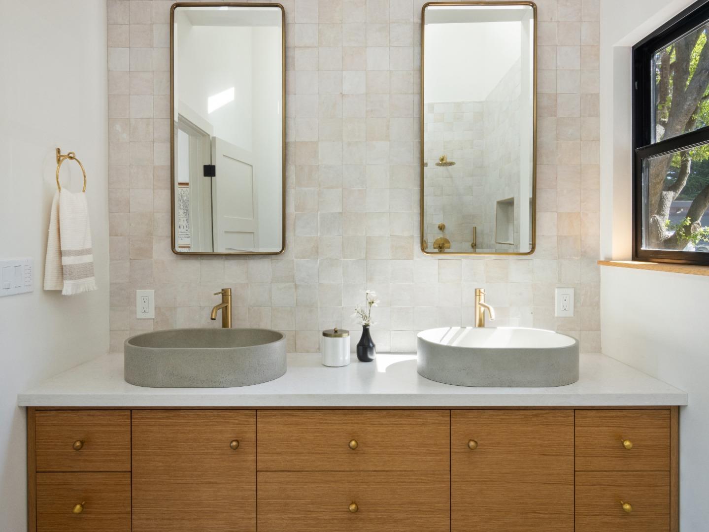 3240 North Main Street Soquel, CA 95073 - Photo 31 of 52 a bathroom with double sink and a mirror