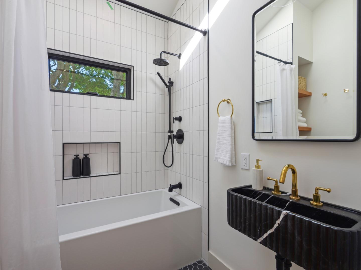 3240 North Main Street Soquel, CA 95073 - Photo 34 of 52 a bathroom with a tub a sink and a window