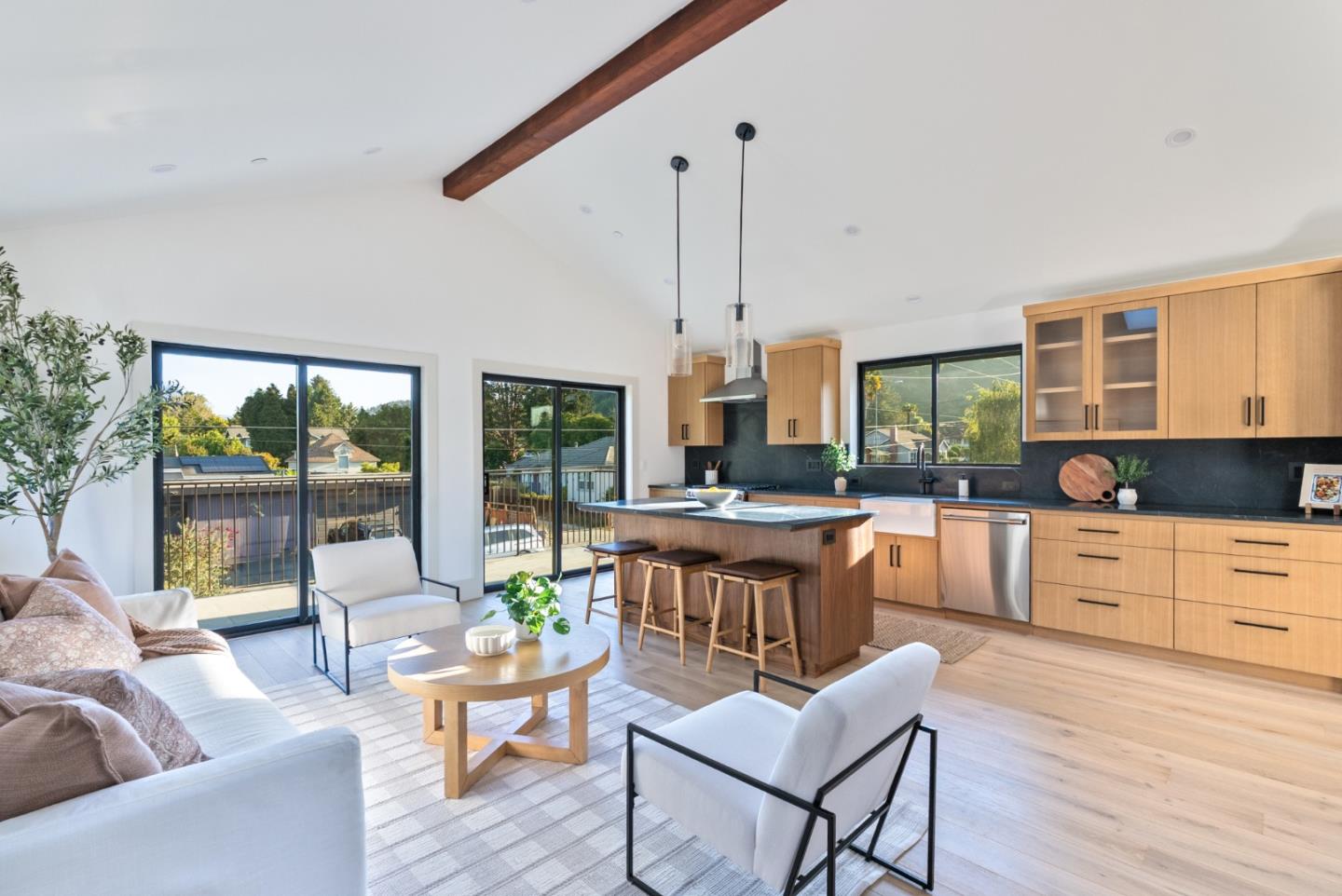 3240 North Main Street Soquel, CA 95073 - Photo 42 of 52 a kitchen with stainless steel appliances kitchen island wooden floors and white cabinets