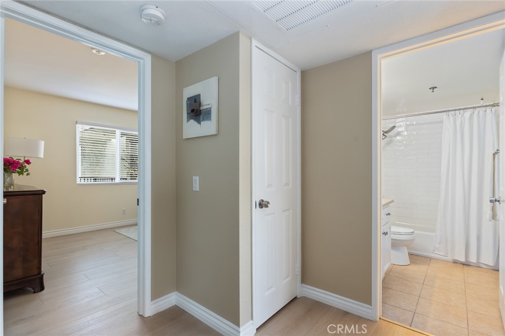 726 Elm Avenue, Unit 404 Long Beach, CA 90813 - Photo 16 of 31 a view of a bathroom with toilet windows and wooden floor