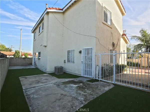 a view of a back yard of the house