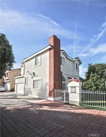a front view of a house with a street