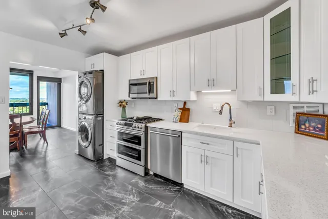 a kitchen with cabinets and appliances