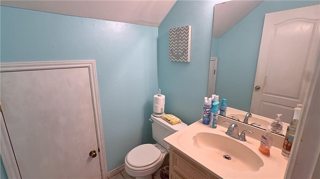 4349 Eldora Drive Corpus Christi, TX 78413 - Photo 11 of 23 a bathroom with a sink a toilet and mirror
