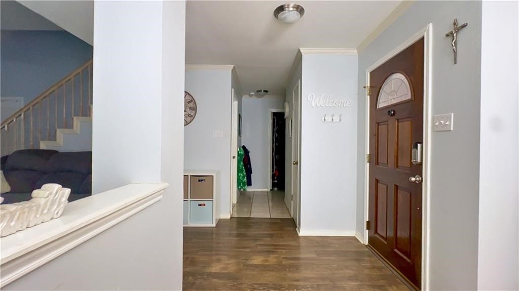 4349 Eldora Drive Corpus Christi, TX 78413 - Photo 4 of 23 a view of a hallway with wooden floor and furniture