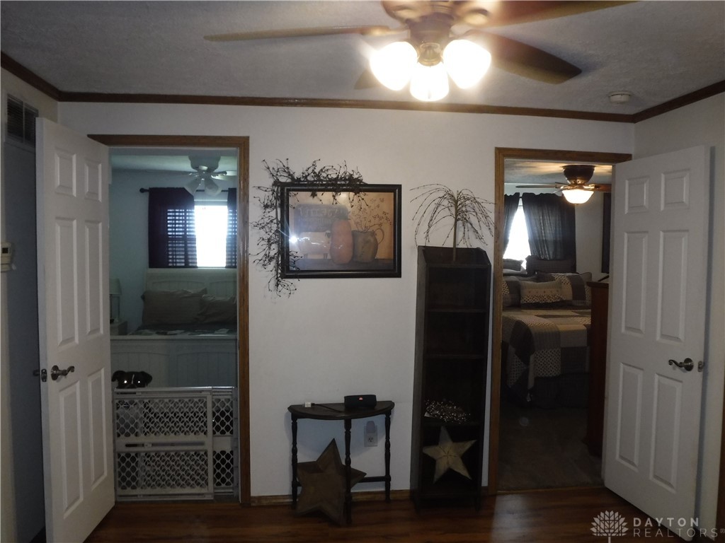 1912 Scheyhing Road Lewisburg, OH 45338 - Photo 15 of 25 looking from family room doorway through dining room bedroom one and primary bedroom right