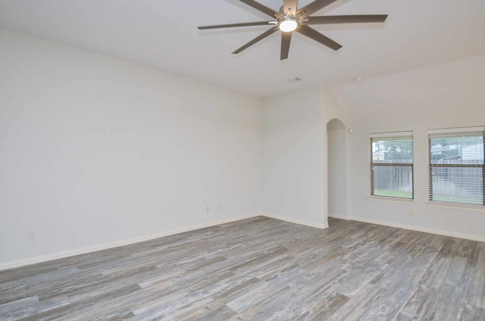 17902 Logans Pine Drive Tomball, TX 77377 - Photo 20 of 32 a view of an empty room with wooden floor and a window