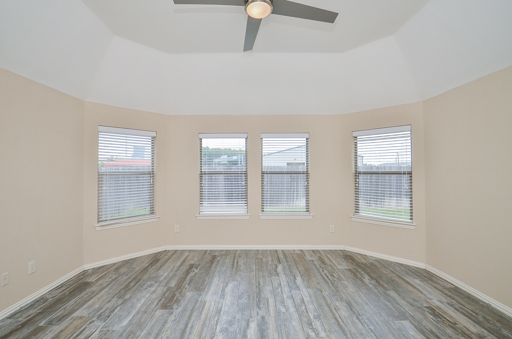 17902 Logans Pine Drive Tomball, TX 77377 - Photo 21 of 32 an empty room with wooden floor and windows