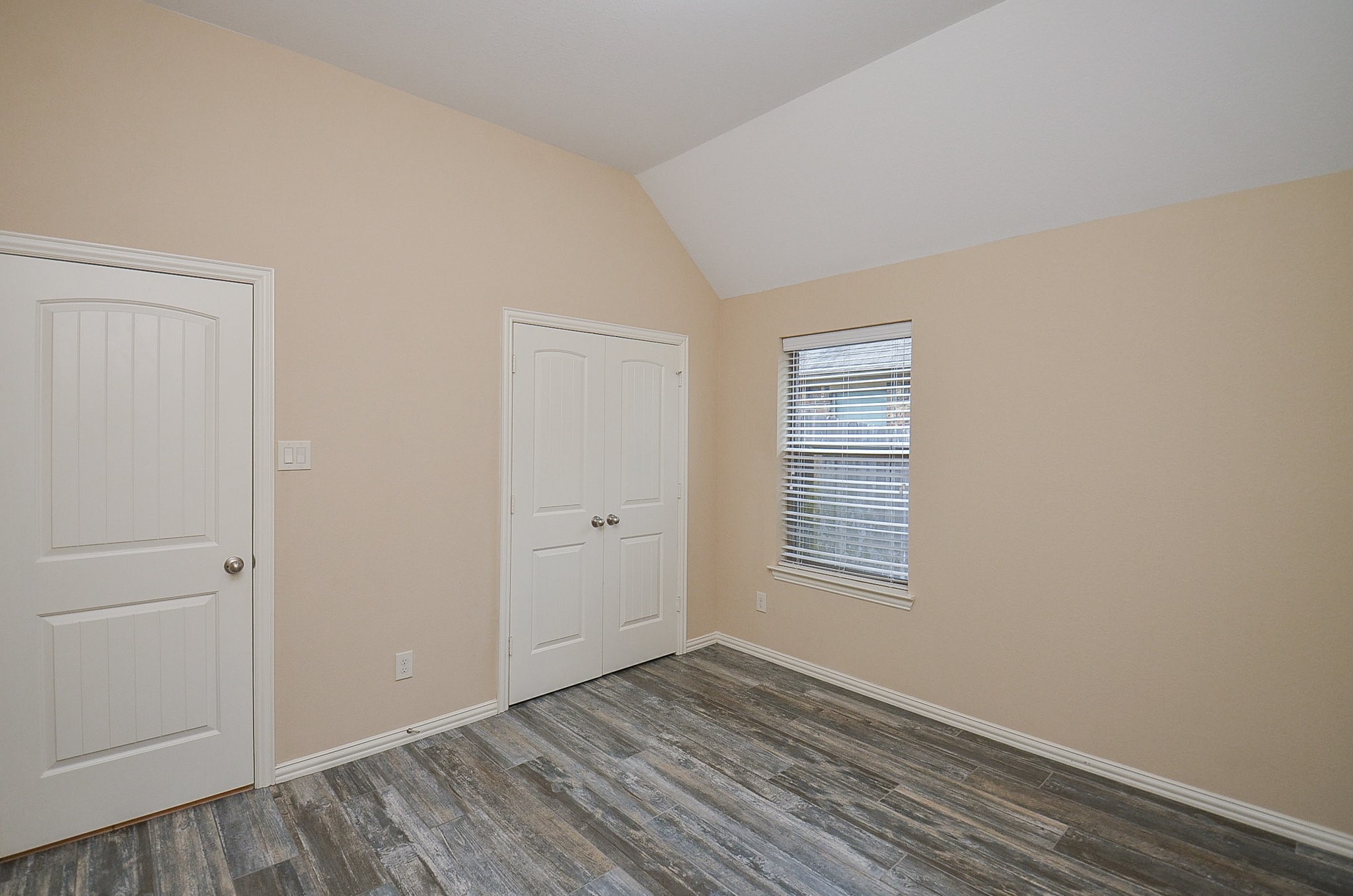 17902 Logans Pine Drive Tomball, TX 77377 - Photo 28 of 32 a view of an empty room with wooden floor and a window